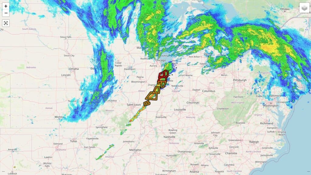 Weather radar map showing a powerful line of severe thunderstorms and tornado warnings stretching from Missouri into Indiana.